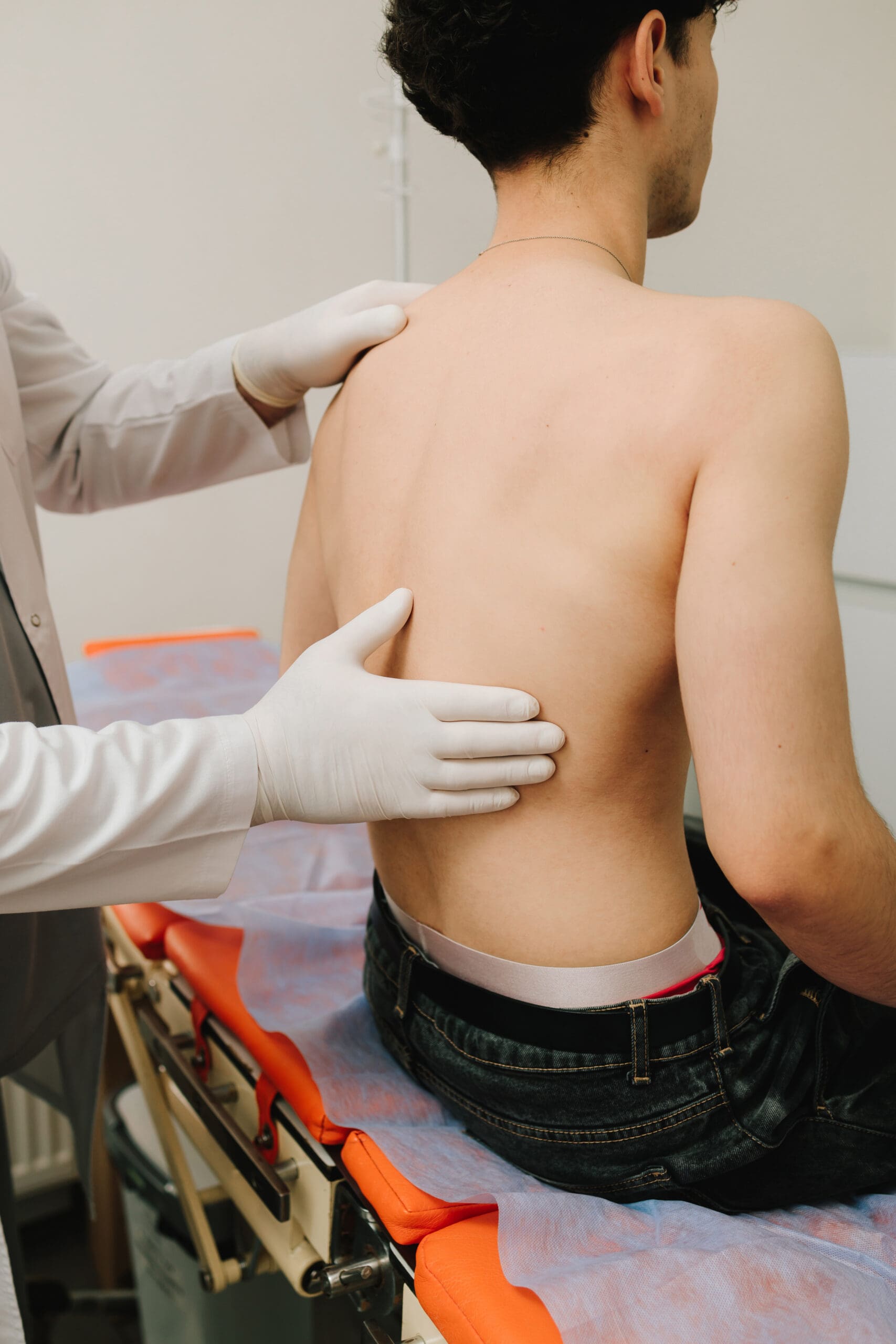 Urologist evaluates kidney tenderness through careful palpation.